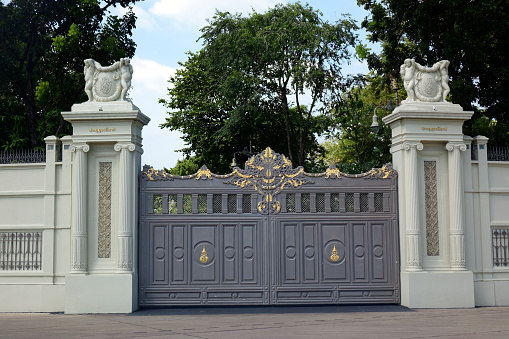 entrance gate to Holland Park in The Royal Borough of Kensington and Chelsea, an affluent area in central London; London, United Kingdom