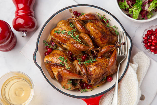 istock Roasted quail with cranberry and thyme on pan 1314802808