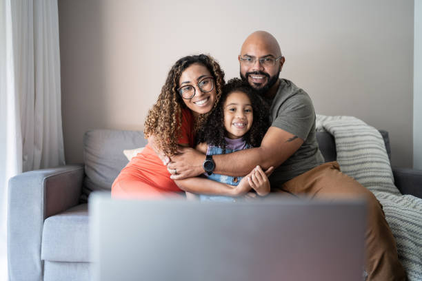 istock Family doing a video call on laptop at home 1314803258