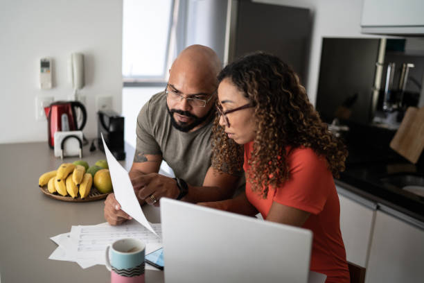 istock Couple doing home finances together at home 1314803331