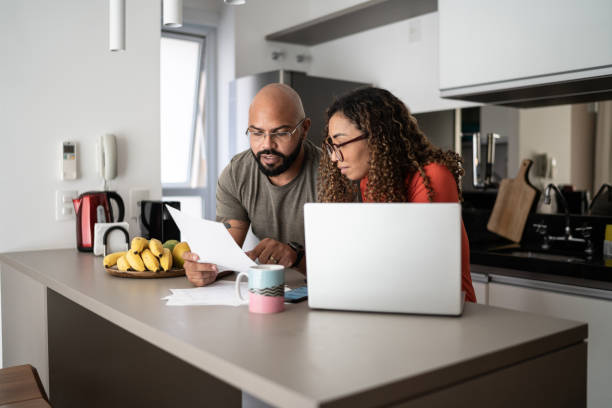 istock Couple doing home finances together at home 1314803335