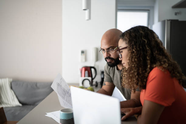 istock Couple doing home finances together at home 1314803344