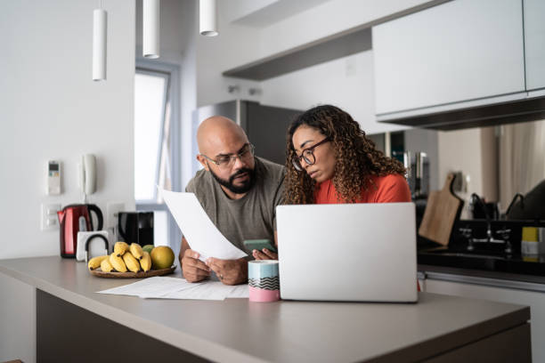 istock Couple doing home finances together at home 1314803347