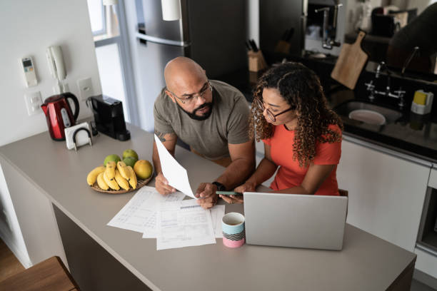 istock Couple doing home finances together at home 1314803351