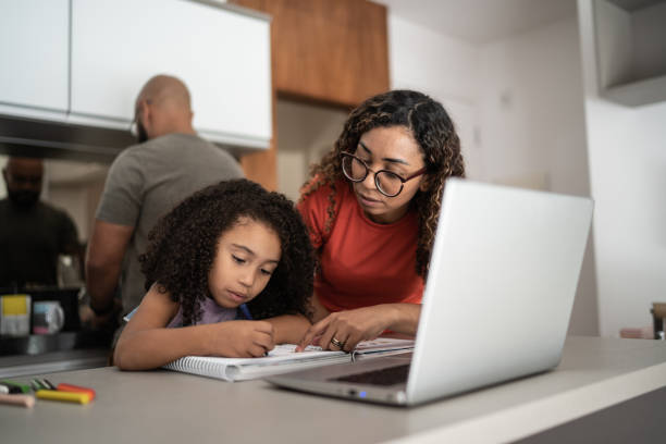 istock Mother helping daughter with homework 1314803997