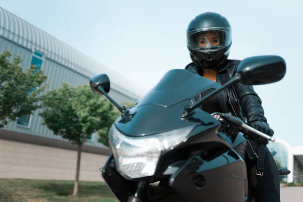 istock Beautiful girl biker is sitting on his motorcycle. 1314804101