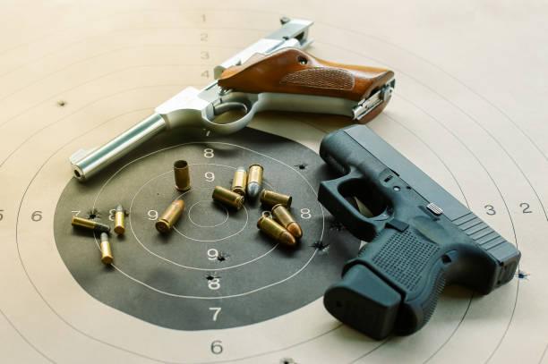 istock Gun with ammunition on black background,ammunition selective focus 1314804804