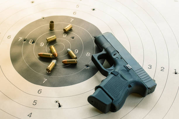 istock Gun with ammunition on black background,ammunition selective focus 1314804829