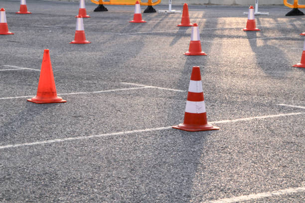 istock Traffic cones placed in row on asphalt 1314806106