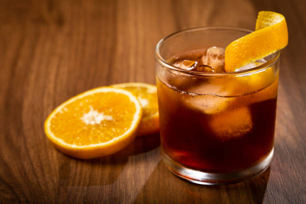 istock Negroni cocktail with orange, on wooden background. 1314807033