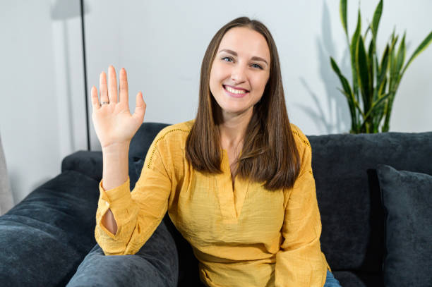 istock A young woman sits at the couch at home 1314808236