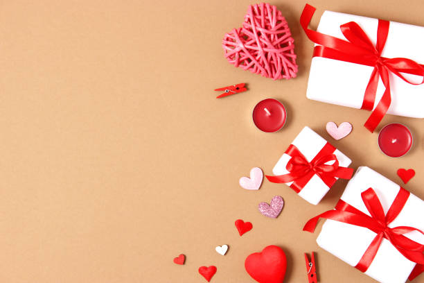 istock Gifts and hearts on a colored background top view. Love. 1314808301