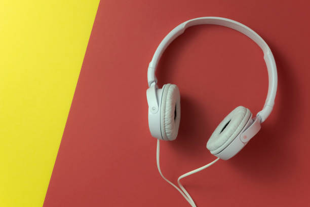 istock White headphones on a red-yellow background 1314808445
