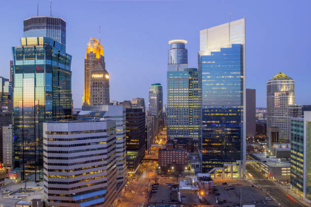 A High Angle Shot Overlooking the Minneapolis Cityscape during Blue Hour A High Wide Angle Long Exposure Shot of the Skyscrapers of Downtown Minneapolis Reflecting Twilight Light During Spring minneapolis stock pictures, royalty-free photos & images