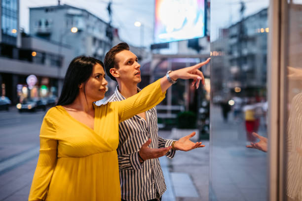 istock Young couple window shopping 1314810081