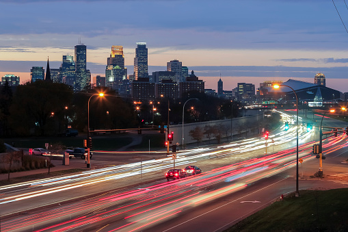 A Long Exposure Shot of Highway Traffic and the Minneapolis Skyline Illuminated during a Vibrant Winter Twilight