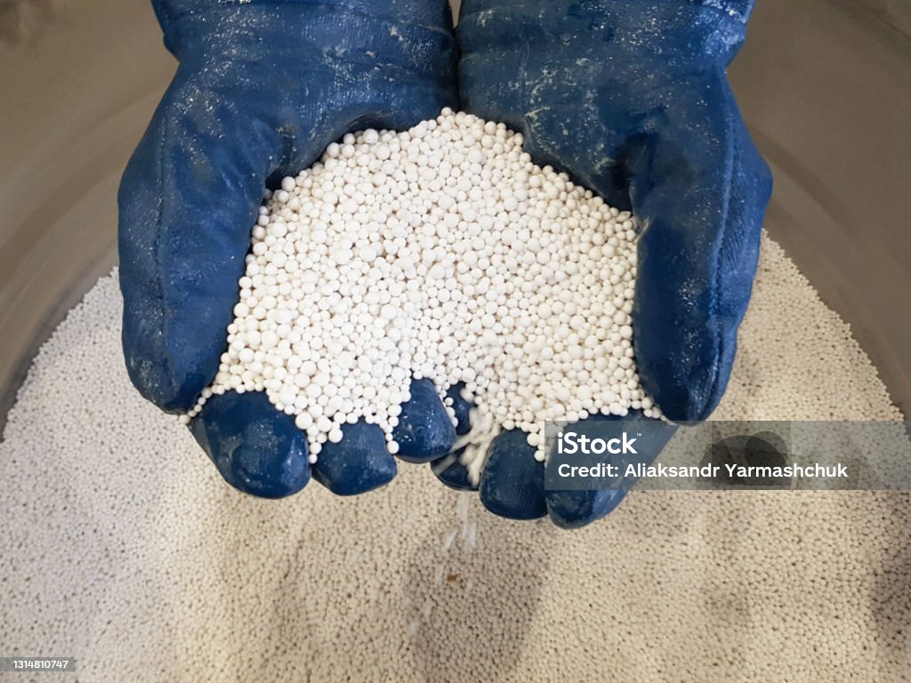 Alumogel and silica gel for drying gases and liquids. White background of alumogel and silica gel. Texture Alumogel and silica gel for drying gases and liquids. White background of alumogel and silica gel. Texture. Dryer Stock Photo