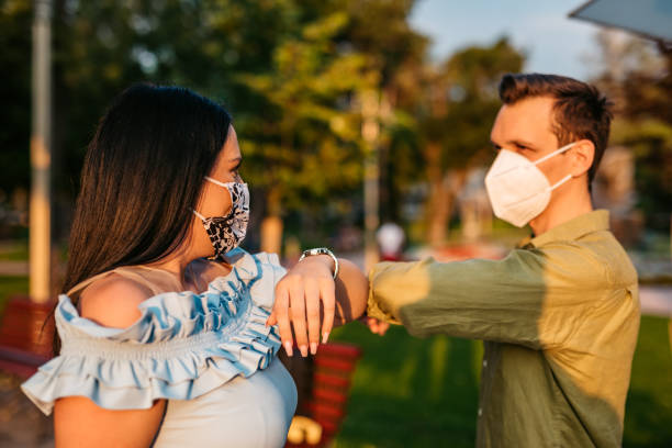 istock Couple greeting with elbow bump on date 1314810753