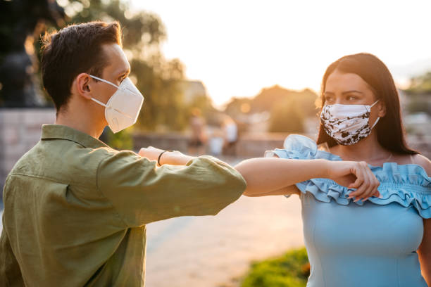 istock Couple greeting with elbow bump on date 1314810782