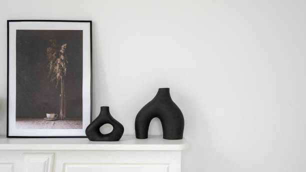 istock Vase and picture frame on shelf above fireplace 1314811900