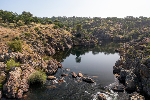 The Stanislaus River and surrounding landscape at Knights Ferry, California in Stanislaus County in the morning.