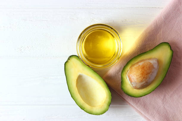 istock Avocado and avocado oil close up on the table 1314813333