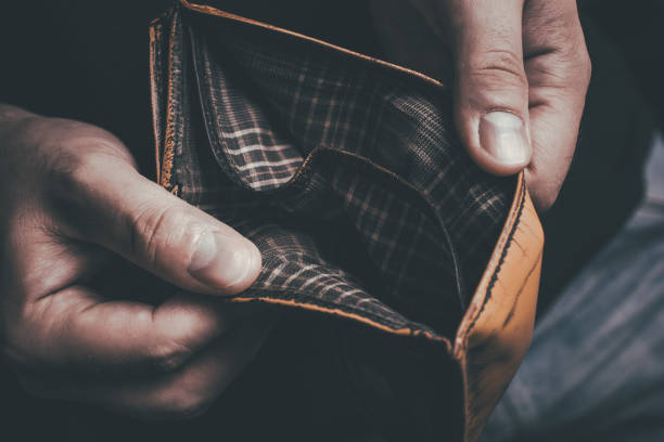 istock Man Showing His Empty Wallet - No Money Left Concept 1314818625