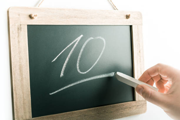 Number 10 Handwritten With Chalk On A Blackboard Number 10 Handwritten With Chalk On Blackboard 10 11 years photos stock pictures, royalty-free photos & images