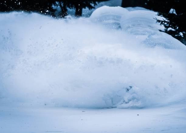 istock Splitboarder descends a steep powder slope in the mountains 1314820099
