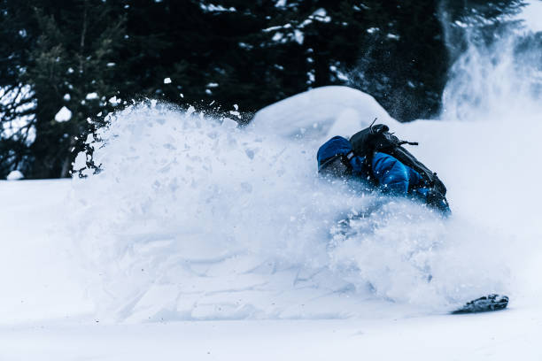 istock Splitboarder descends a steep powder slope in the mountains 1314820145