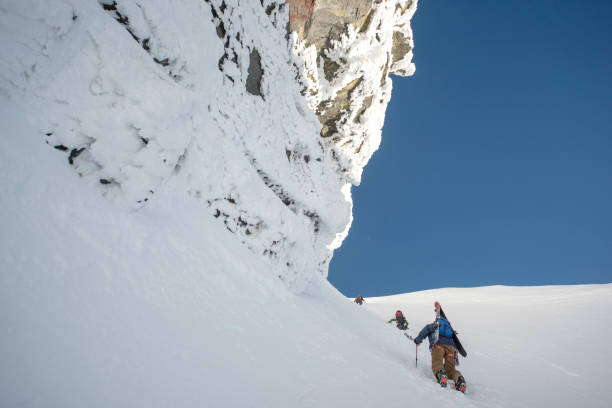 istock Ski mountaineers climb steep mountain slope 1314822173