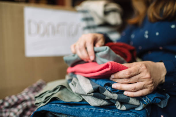 istock Women choosing clothes to donate 1314823221