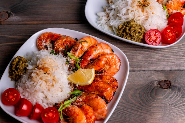 istock selected focus a plate of fried shrimp and white rice with pesto sauce 1314823708