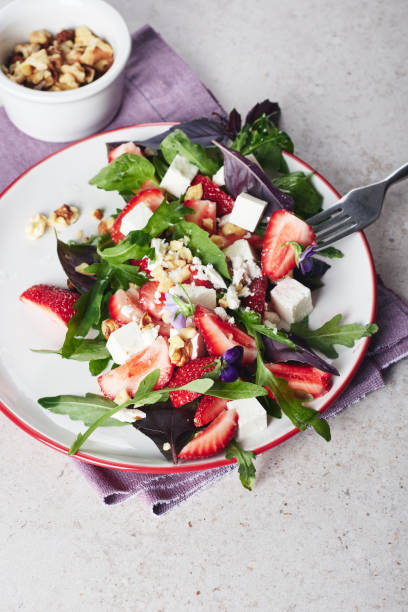 istock Salad with strawberries, arugula and cheese. 1314823728