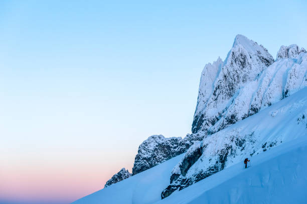 istock Ski mountaineer climbs snowy mountain slope 1314825238