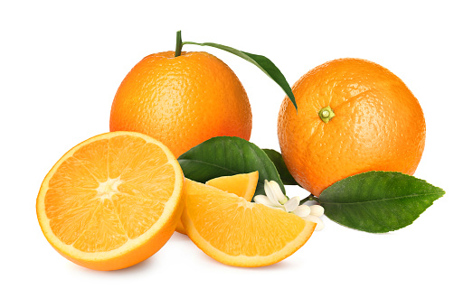 Orange fruit and half sliced with green leaf isolated on white background.