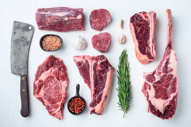 marbled beef meat steak cut, tomahawk, t bone, club steak, rib eye and tenderloin cuts, on white stone  background, top view flat lay - veal t bone steak raw steak imagens e fotografias de stock