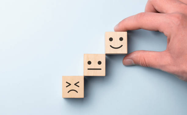 istock Customer showing rating with happy icon on blue background, Customer satisfaction survey concept, copy space. 1314830353