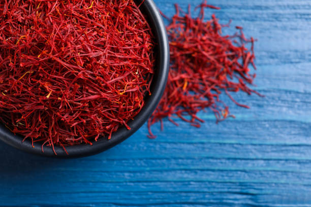 istock Dried saffron on blue wooden table, flat lay. Space for text 1314831747