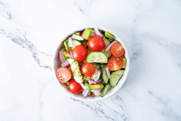 istock Cucumber tomato avocado red onion salad 1314833330