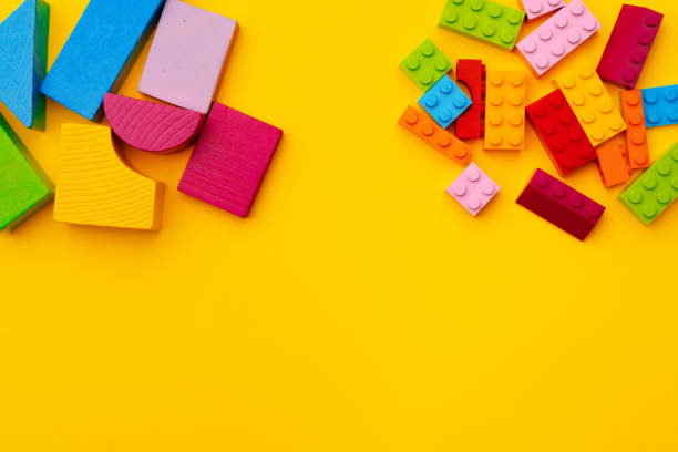 istock Toy kid's constructor on yellow background top view 1314835416