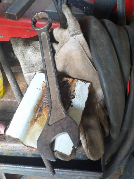 istock Aerial view of old spanner with woodworking materials background. Workbench, tools and old utensils in French West Indies workshop. 1314836486