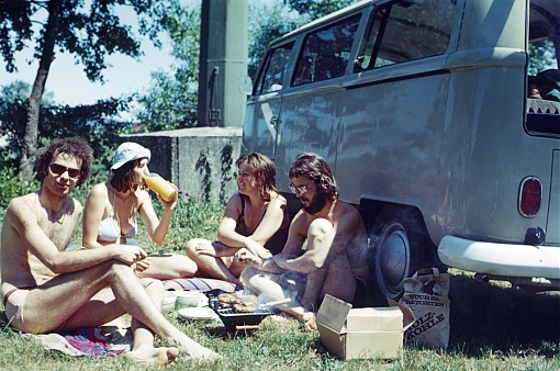 Greece, 1978. Young students from Central Europe take a lunch break from driving next to their VW bus.