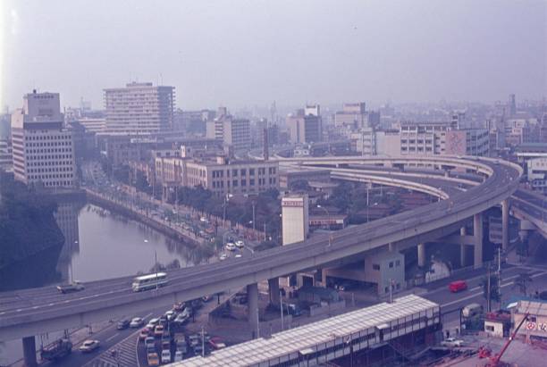 Tokyo, Honshu, Japan, 1968. Tokyo city center. On the left a part of the imperial palace.