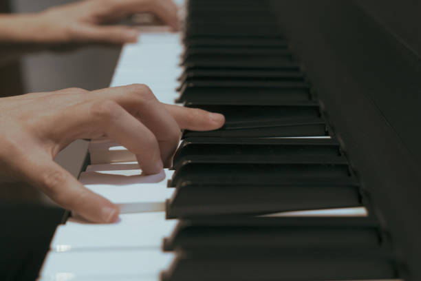 istock Woman playing a song on her piano 1314838736