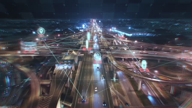 4K resolution Night Aerial view road traffic with HUD Multi path Visual tracker target, transportation Technology Icon with connection line, Networking and  telecommunications technology concept, Futuristic design for business finance and technology advertising