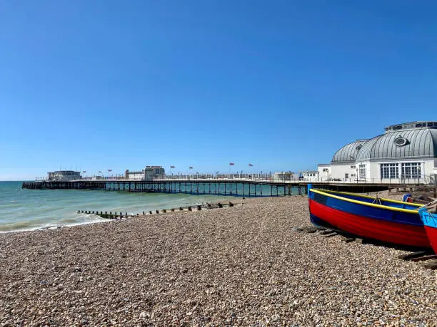 The pebble beach and pier at Worthing in West Sussex, UK