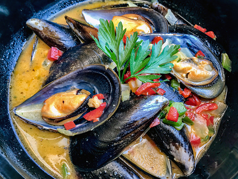 Seafood paella served in a cast iron pan.