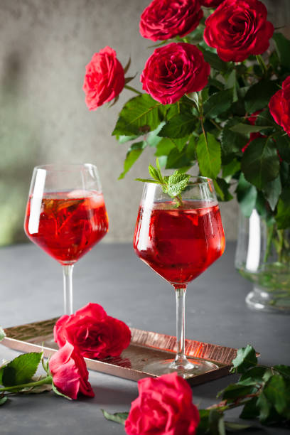 istock Two alcohol cocktails set with red roses 1314845191