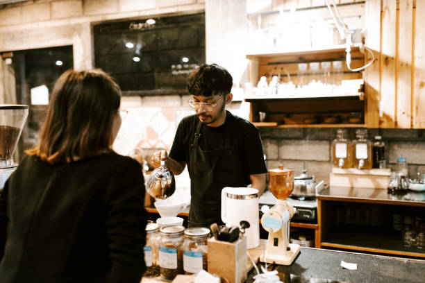 istock woman taking his order at a coffee shop 1314847828
